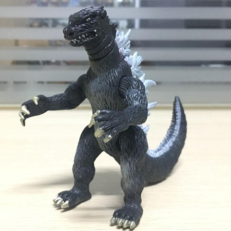 Godzilla ornamen tangan untuk melakukan telur asin Superman rakasa boneka model dinosaurus mainan anak atas nama Peach grosir